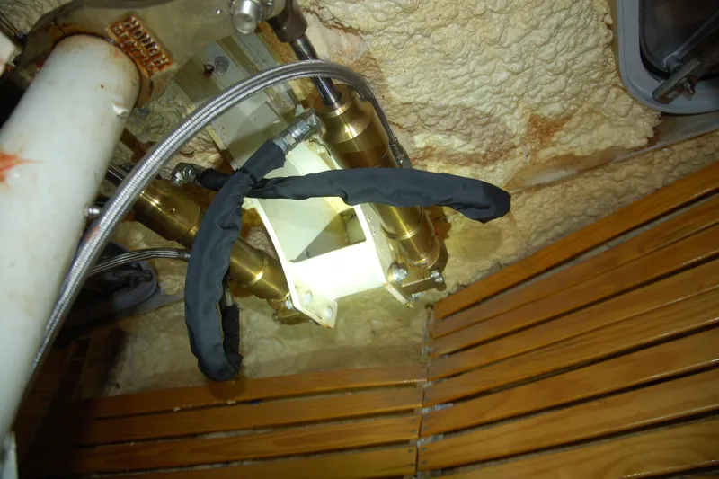 Slide: The Image of Custom Sprague 2006 plumbing system with insulated pipes and wooden paneling. - 147