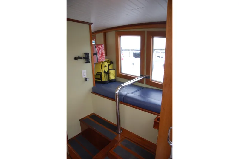 Slide: The Image of Interior of 2006 Custom Sprague boat with seating, windows, and life jackets. - 15