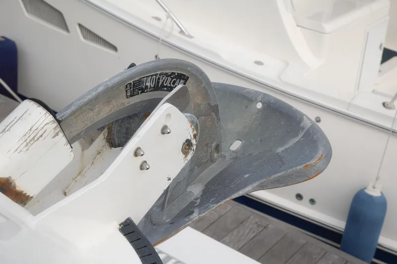 Slide: The Image of Close-up of a 2006 Custom Sprague boat anchor labeled "40 Vulcan" at a dock. - 150