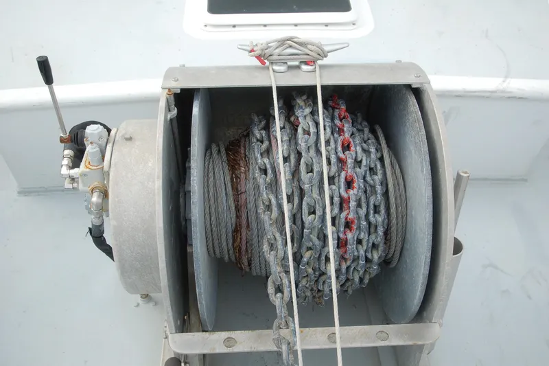 Slide: The Image of Close-up of a 2006 Custom Sprague winch with coiled chain and cable. - 151