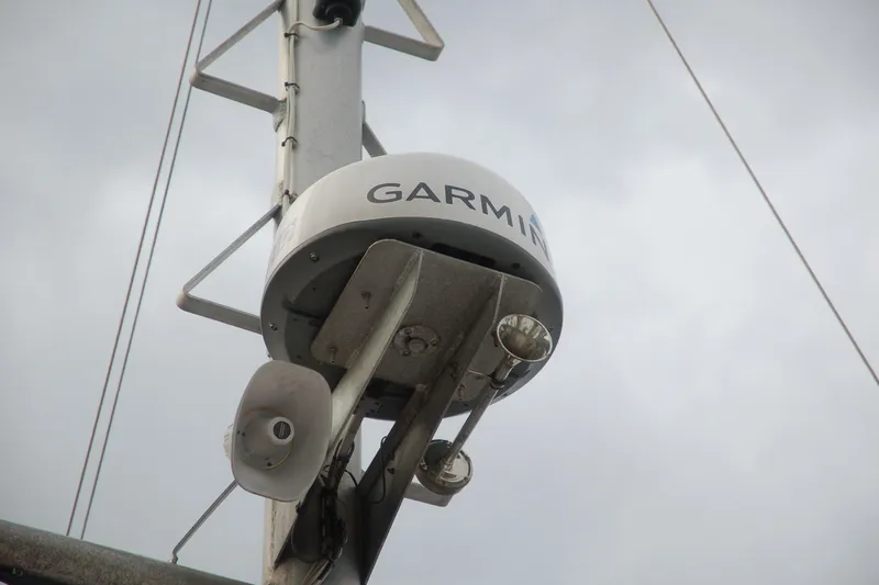 Slide: The Image of Garmin radar on a Custom Sprague 2006 mast against cloudy sky. - 152