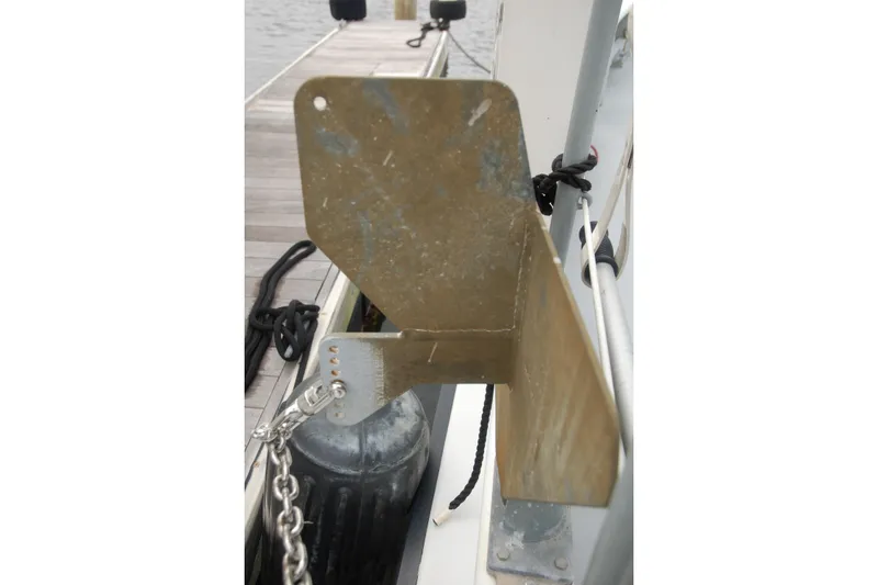 Slide: The Image of Boat anchor mount on Custom Sprague, 2006, docked with chain and ropes. - 153