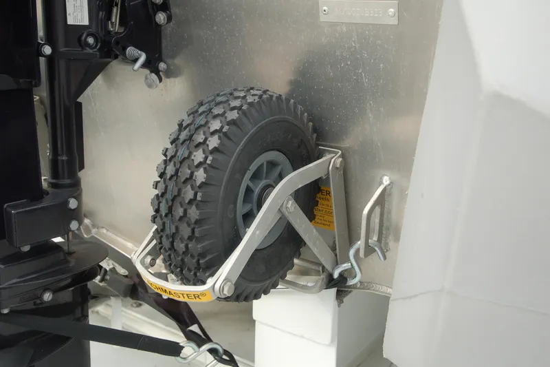 Slide: The Image of Custom 2006 Sprague model with a mounted spare tire and secure bracket. - 155