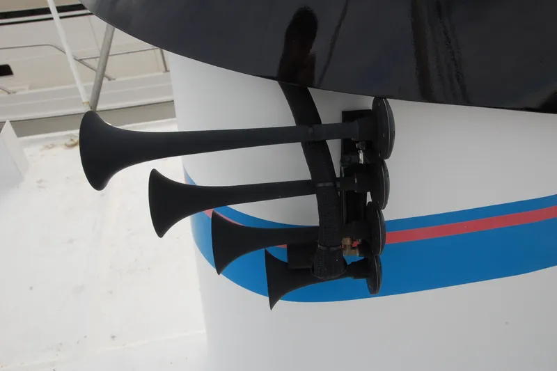 Slide: The Image of Custom 2006 Sprague model with triple air horns on a white and blue-striped surface. - 159