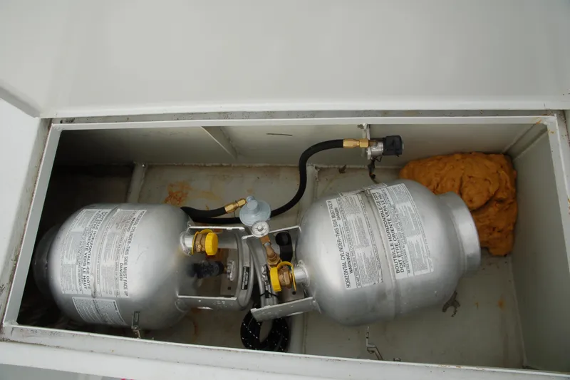 Slide: The Image of Two propane tanks in a storage compartment, Custom Sprague model, 2006. - 165