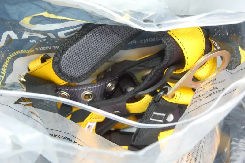 Slide: The Image of Yellow safety harness in a plastic bag, Custom Sprague model, 2006. - 169