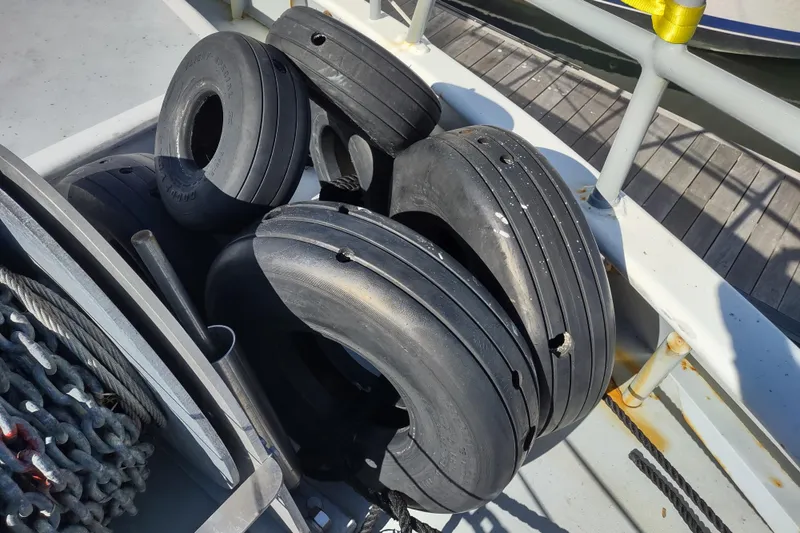 Slide: The Image of Rubber tires on a Custom Sprague 2006 boat deck, used as fenders. - 173