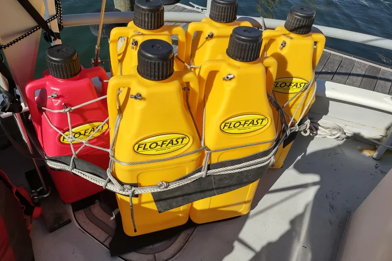 Slide: The Image of Yellow and red Flo-Fast fuel containers secured on a boat deck, Custom Sprague 2006. - 175