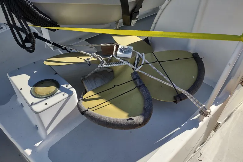 Slide: The Image of Custom 2006 Sprague boat propeller secured with ropes on deck. - 176