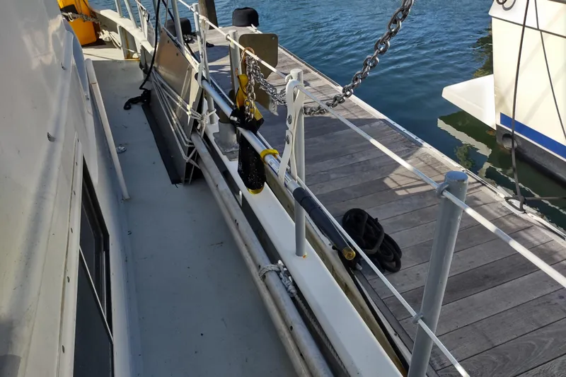Slide: The Image of Boat deck with railing, docked at marina, Custom Sprague 2006 model. - 178