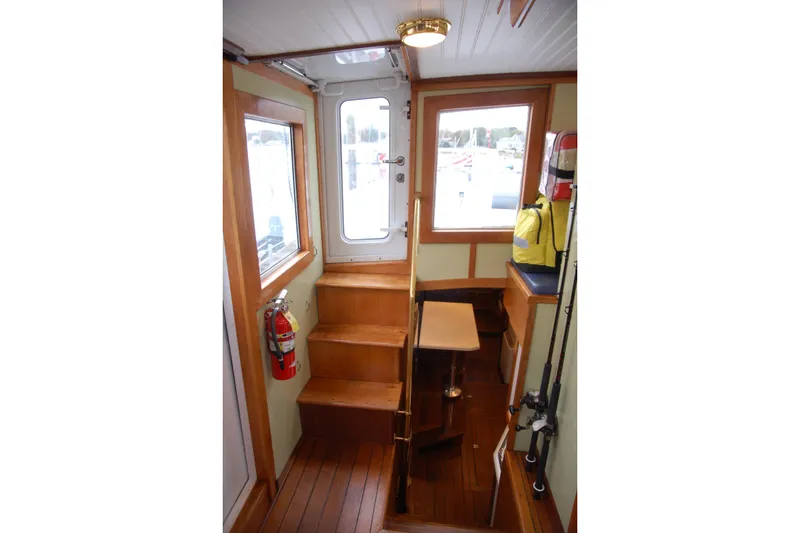 Slide: The Image of Interior of 2006 Custom Sprague boat with wooden stairs and safety equipment. - 19