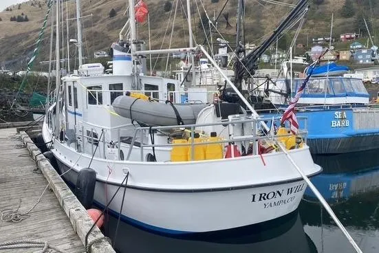 Slide: The Image of Fishing boat "Iron Will" docked, Custom Sprague model, 2006, with equipment and flags. - 2