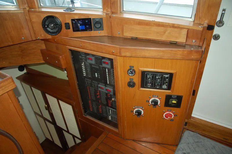 Slide: The Image of Control panel of a 2006 Custom Sprague boat with wooden interior and gauges. - 20