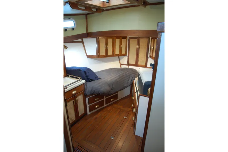 Slide: The Image of Cozy 2006 Custom Sprague boat cabin with wooden interior and comfortable bedding. - 27