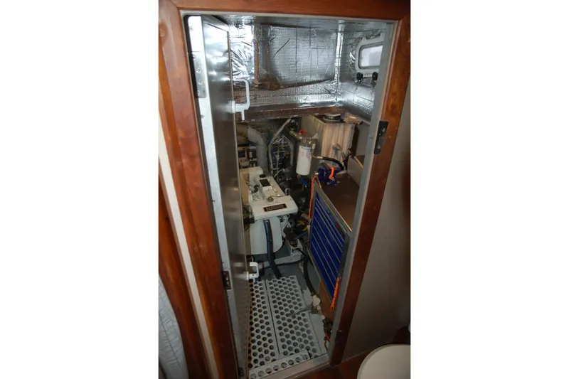 Slide: The Image of Engine room of a 2006 Custom Sprague boat with visible machinery and insulation. - 39