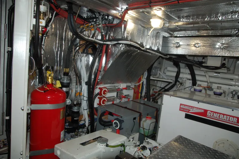Slide: The Image of Engine room of a 2006 Custom Sprague with generator and fire extinguisher. - 40