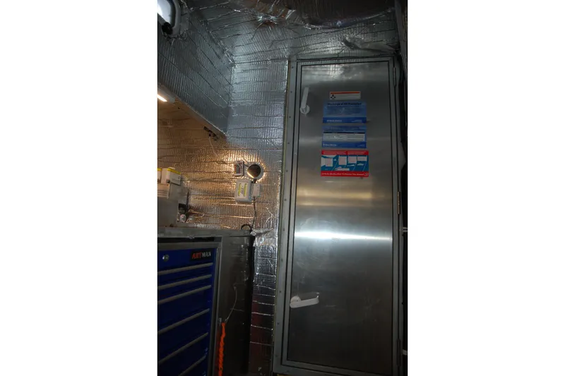 Slide: The Image of Industrial interior with metallic door, insulation, and tool chest, Custom Sprague 2006 model. - 45
