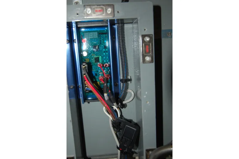 Slide: The Image of Close-up of a 2006 Custom Sprague electrical panel with wiring and circuit board. - 68