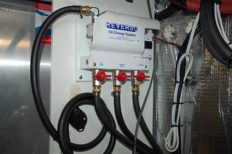 Slide: The Image of Reverso oil change system with hoses, Custom Sprague 2006 model, installed in an engine room. - 70