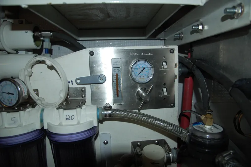 Slide: The Image of Control panel of a 2006 Custom Sprague machine with gauges and filters. - 74