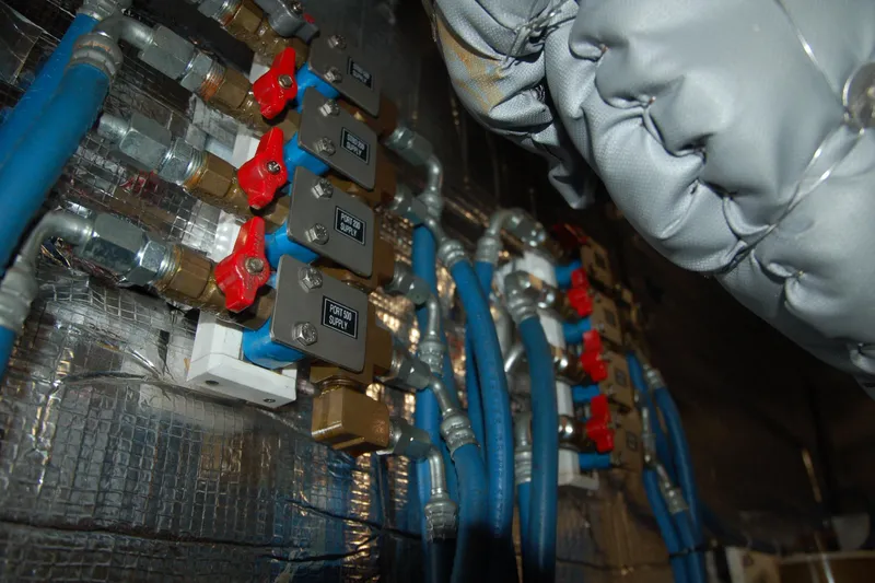 Slide: The Image of Industrial piping system with blue hoses and red valves, Custom Sprague 2006 model. - 80