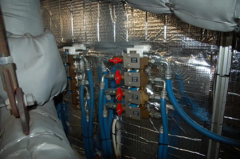 Slide: The Image of Industrial piping system with blue hoses and valves, Custom Sprague model, 2006. - 81