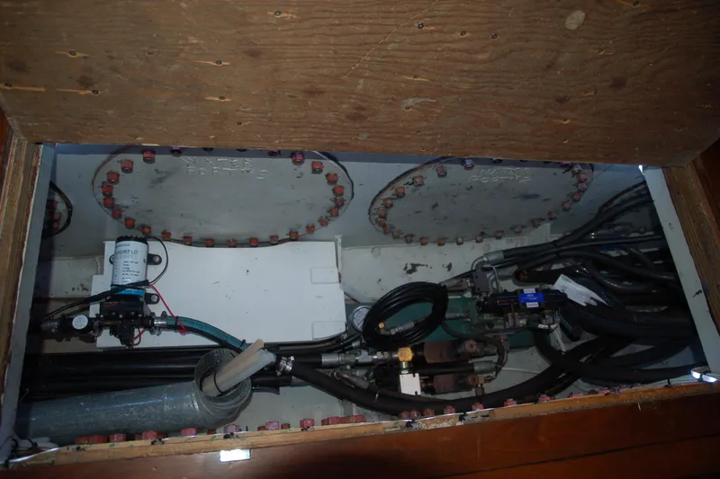 Slide: The Image of Custom 2006 Sprague model machinery with pipes and valves in a wooden compartment. - 86