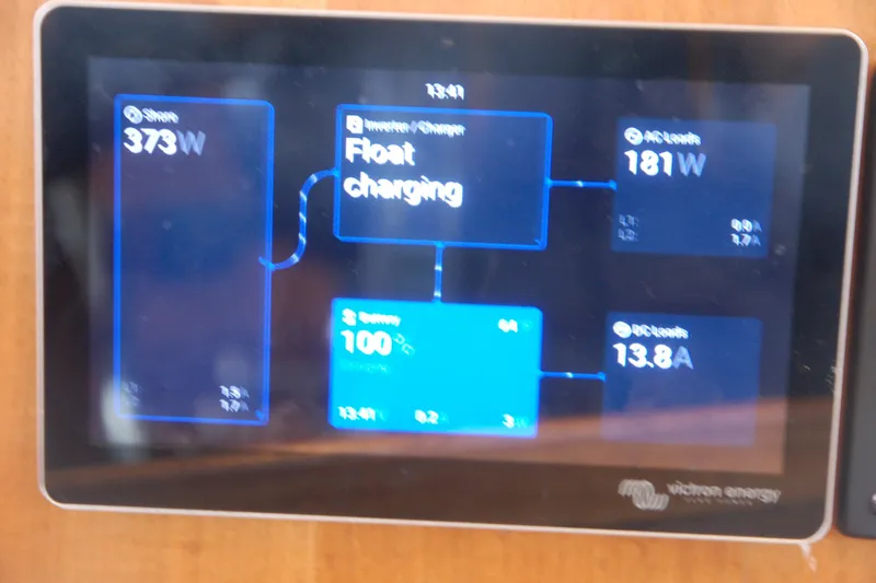 Slide: The Image of Touchscreen display showing power management system with float charging status, Custom Sprague 2006 model. - 89
