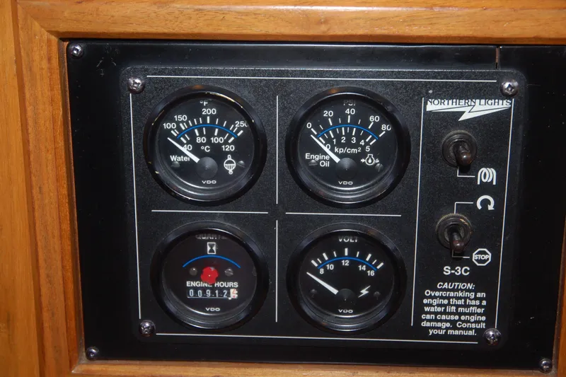 Slide: The Image of 2006 Custom Sprague control panel with gauges for water, engine oil, voltage, and engine hours. - 90