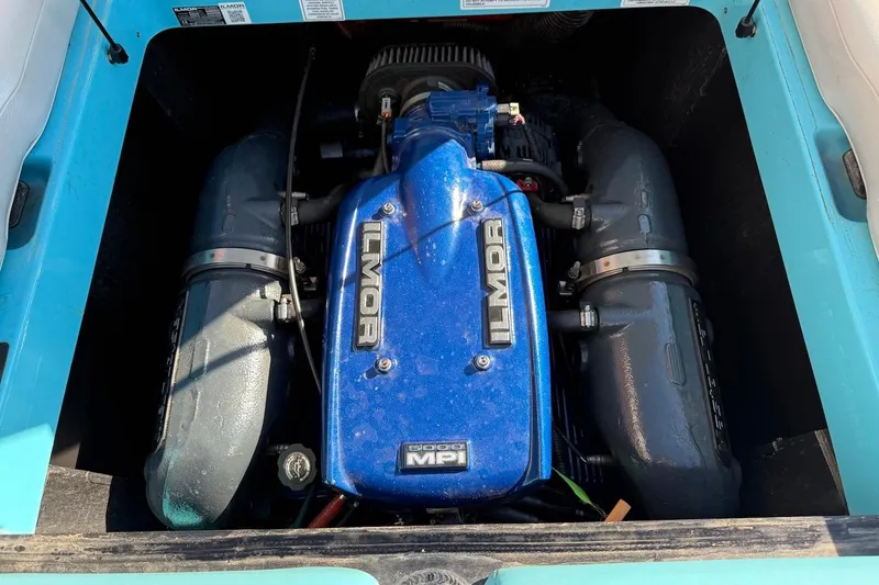 Slide: The Image of 2018 MasterCraft NXT22 Ilmor engine, blue cover, detailed view. - 21