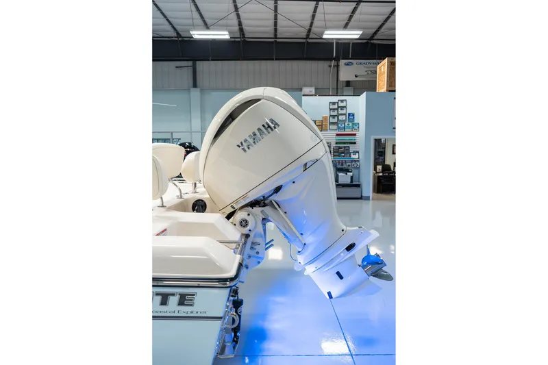 Slide: The Image of 2025 Grady-White 251 Coastal Explorer with Yamaha outboard engine in showroom. - 11