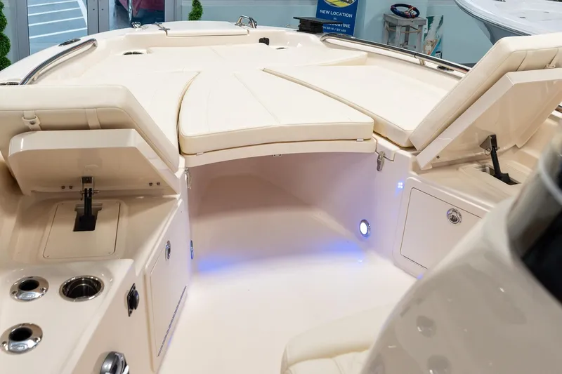 Slide: The Image of 2025 Grady-White 251 Coastal Explorer boat interior with seating and storage compartments. - 12