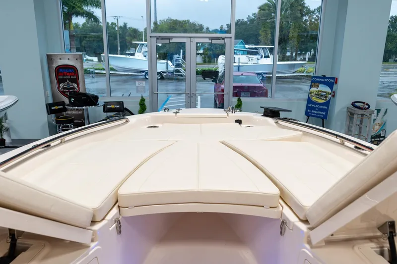 Slide: The Image of 2025 Grady-White 251 Coastal Explorer boat interior in showroom setting. - 14