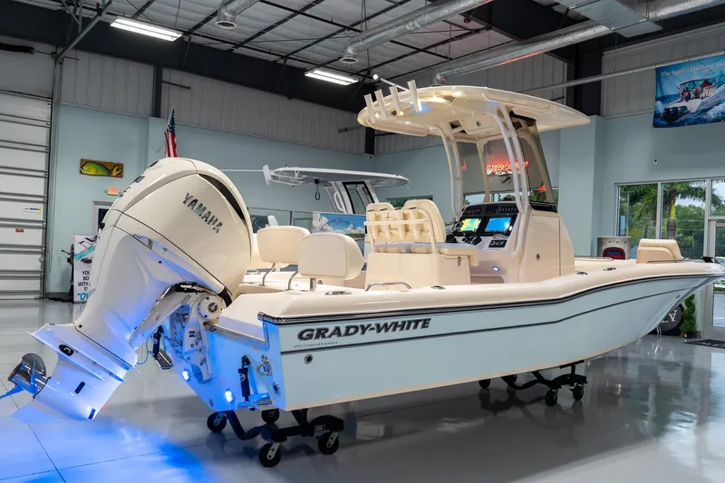 Slide: The Image of 2025 Grady-White 251 Coastal Explorer boat displayed in showroom. - 2