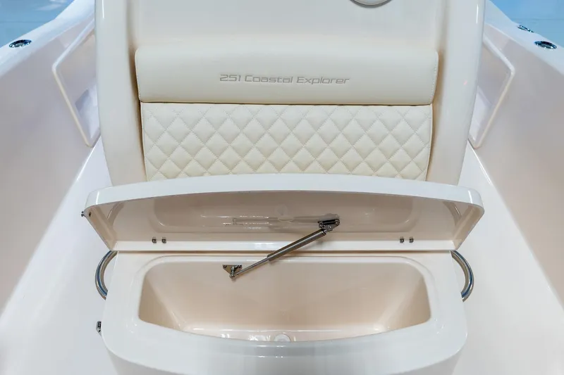 Slide: The Image of 2025 Grady-White 251 Coastal Explorer boat seat with storage compartment open. - 20