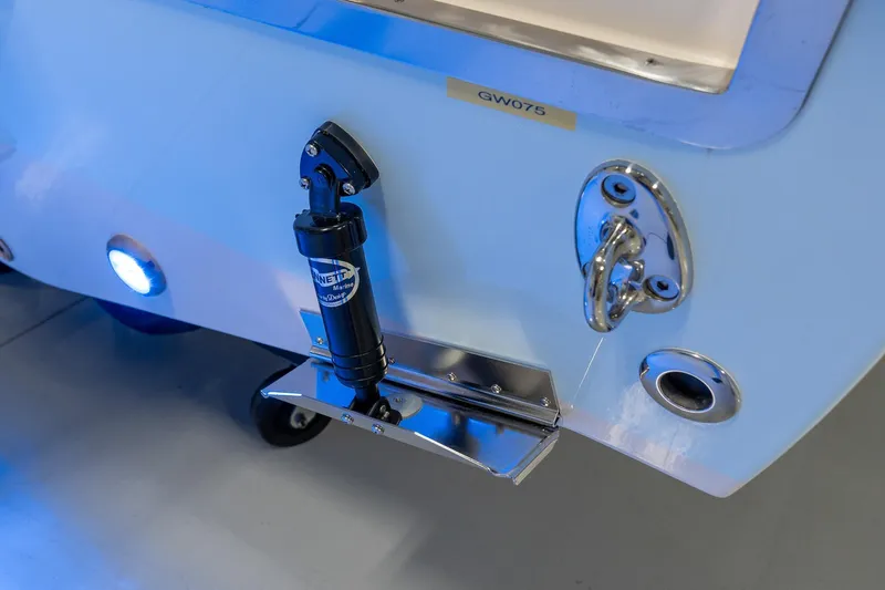 Slide: The Image of 2025 Grady-White 251 Coastal Explorer boat transom with marine hardware and lighting. - 27