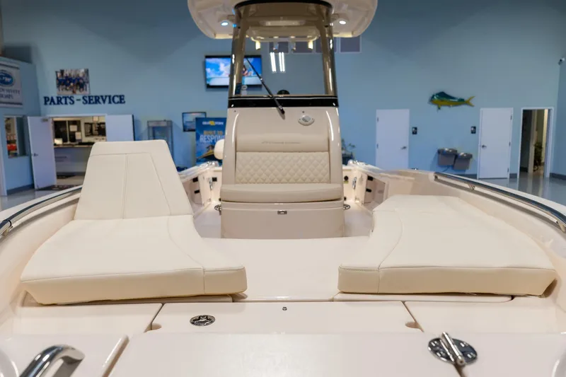 Slide: The Image of 2025 Grady-White 251 Coastal Explorer boat interior with cushioned seating. - 6