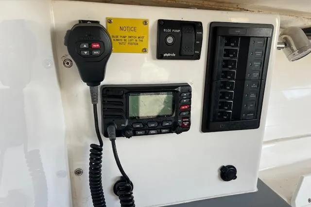 Slide: The Image of Control panel of a 2017 J Boats J/88, featuring radio and bilge pump switches. - 15