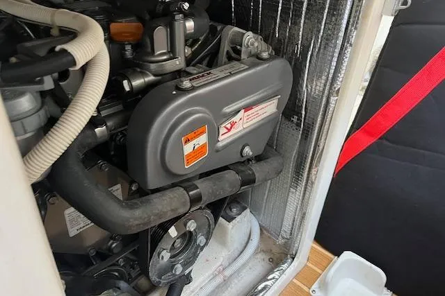 Slide: The Image of Engine compartment of a 2017 J Boats J/88 sailboat, showcasing mechanical components. - 16