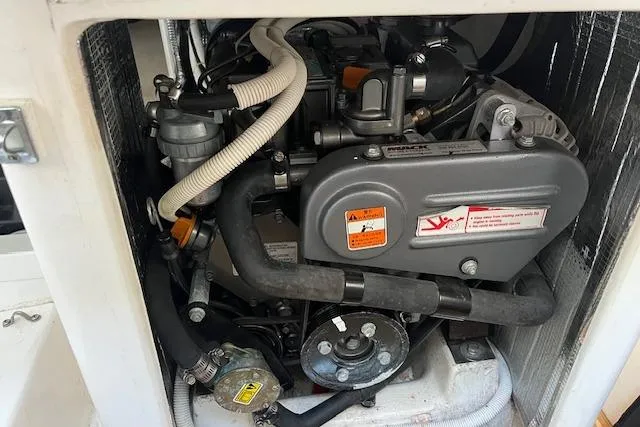 Slide: The Image of Engine compartment of a 2017 J Boats J/88 sailboat, showcasing mechanical components. - 17