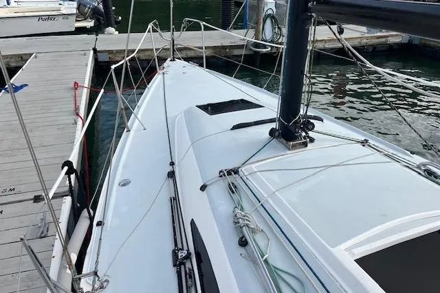 Slide: The Image of 2017 J Boats J/88 sailboat docked at marina, showing deck and rigging. - 22