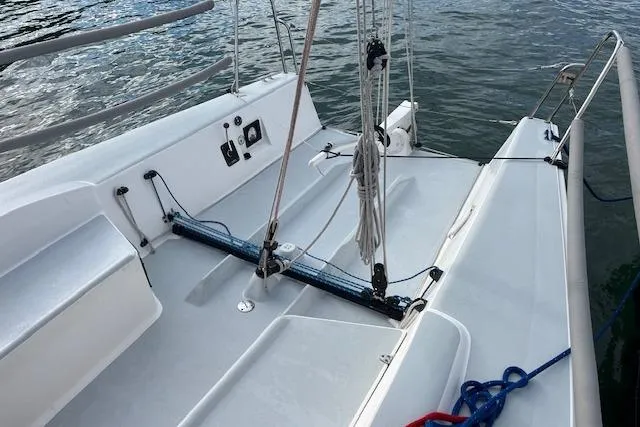 Slide: The Image of 2017 J Boats J/88 sailboat cockpit with ropes and controls on calm water. - 25