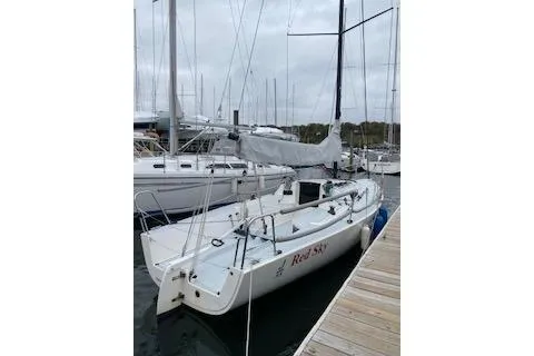 Slide: The Image of 2017 J Boats J/88 sailboat docked at marina, overcast sky. - 27