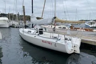 Slide: The Image of 2017 J Boats J/88 sailboat docked in marina, named "Red Sky." - 28