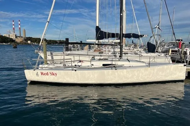 Slide: The Image of 2017 J Boats J/88 sailboat named "Red Sky" docked in a marina. - 5
