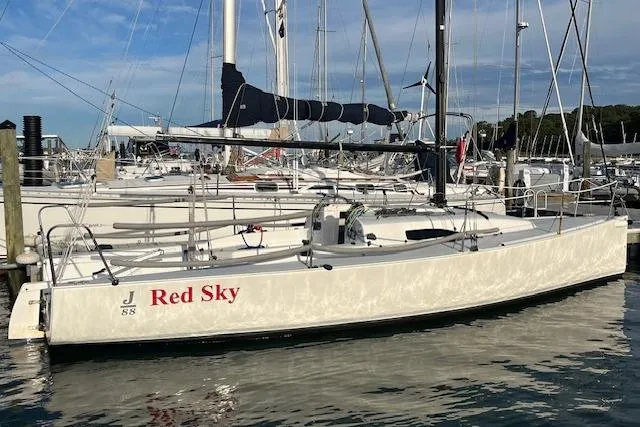 Slide: The Image of 2017 J Boats J/88 sailboat named "Red Sky" docked at a marina. - 6