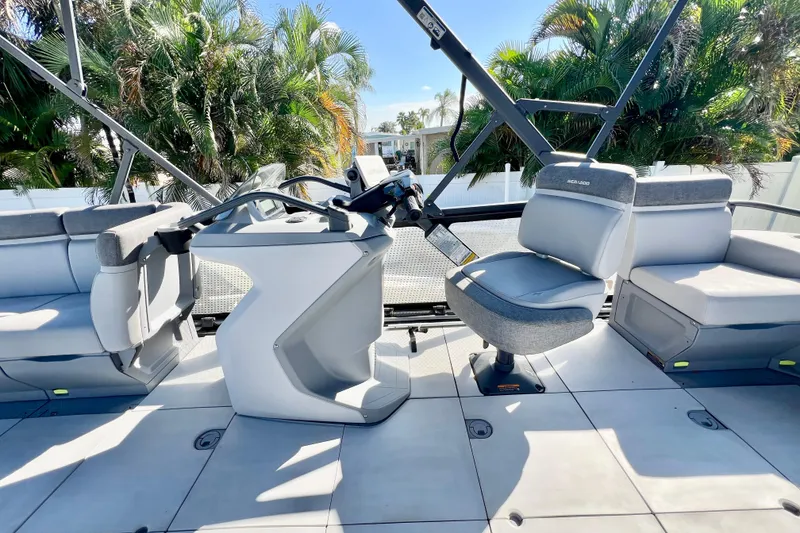 Slide: The Image of 2023 Sea-Doo Switch Cruise 21 interior with modern seating and steering console. - 13