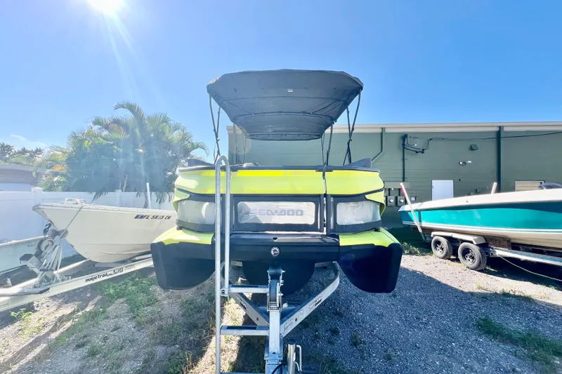 Slide: The Image of 2023 Sea-Doo Switch Cruise 21 on trailer under sunny sky. - 3