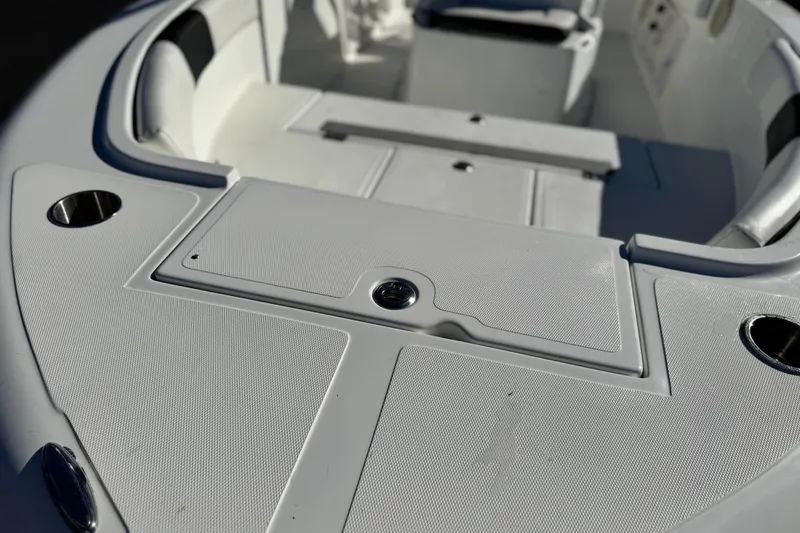 Slide: The Image of Clearwater 2000 C/C 2021 boat interior with seating and storage compartments. - 10