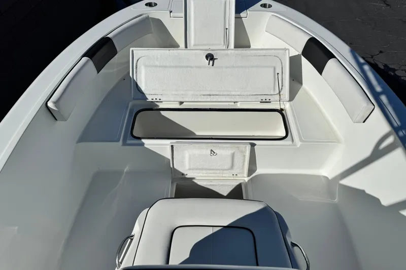 Slide: The Image of 2021 Clearwater 2000 C/C boat interior with open storage compartments. - 13